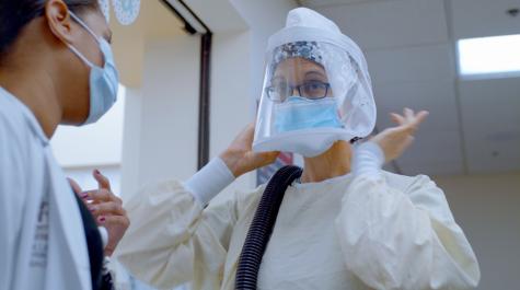 medical worker wearing protective covid equipment